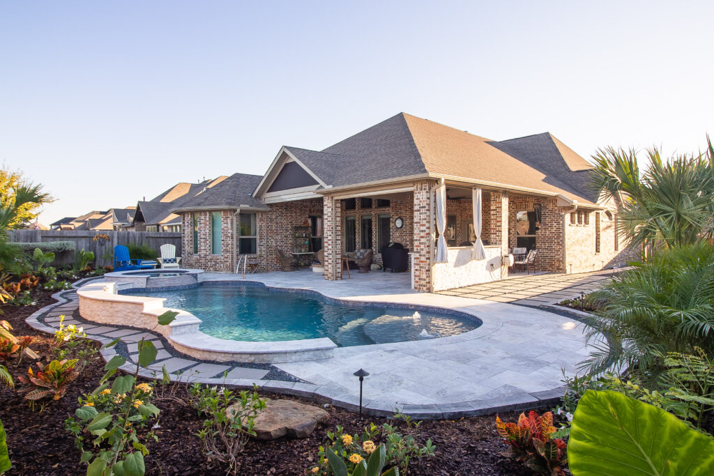 An in-ground pool and spa built by Southern Charm Pools.
